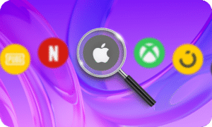 Magnifying glass focusing on Apple gift card logo surrounded by other digital gift card icons including Netflix, Xbox, PUBG, and Smile on a purple background