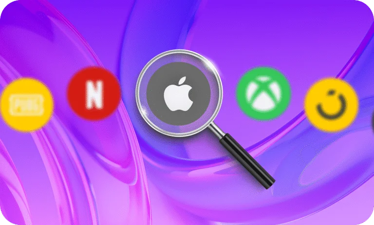 Magnifying glass highlighting Apple gift card among Netflix, Xbox, and PUBG icons on a purple background.